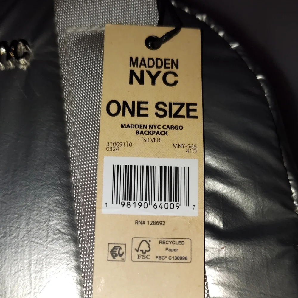 Steve Madden Silver Backpack. Front and side pockets.